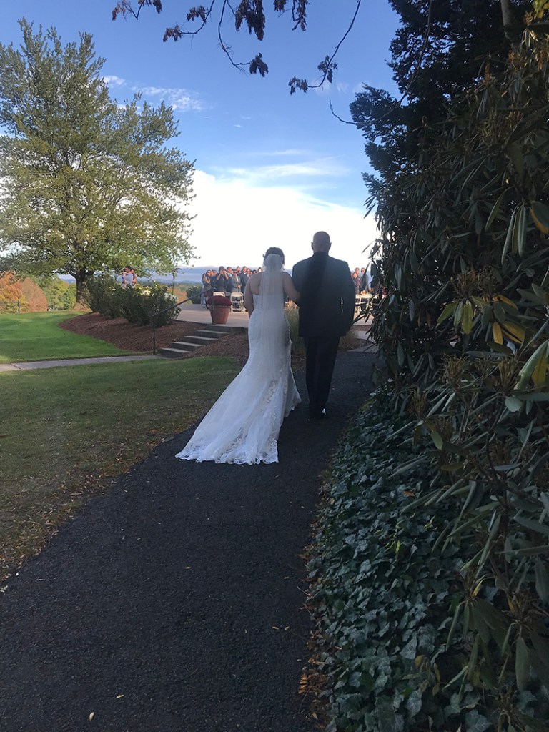 bride and groom walking on the course