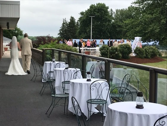 bride walking down outdoors patio